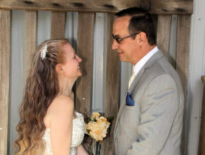 A bride and groom looking at each other.